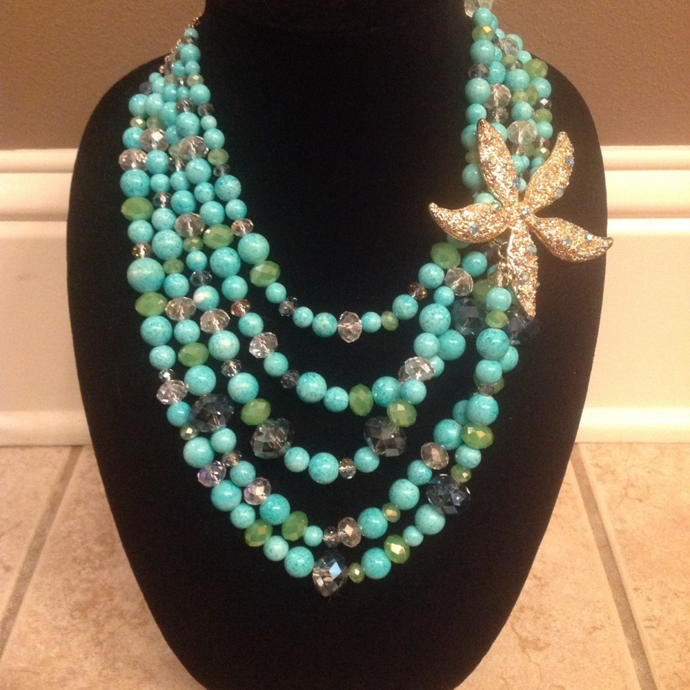 Elegant turquoise colored , crystal and Gold Beaded Necklace with large starfish